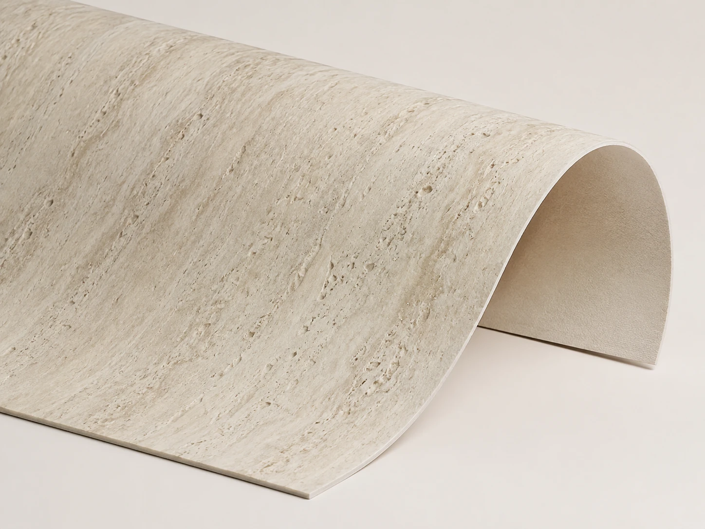 Flexible stone sheet for curved wall applications