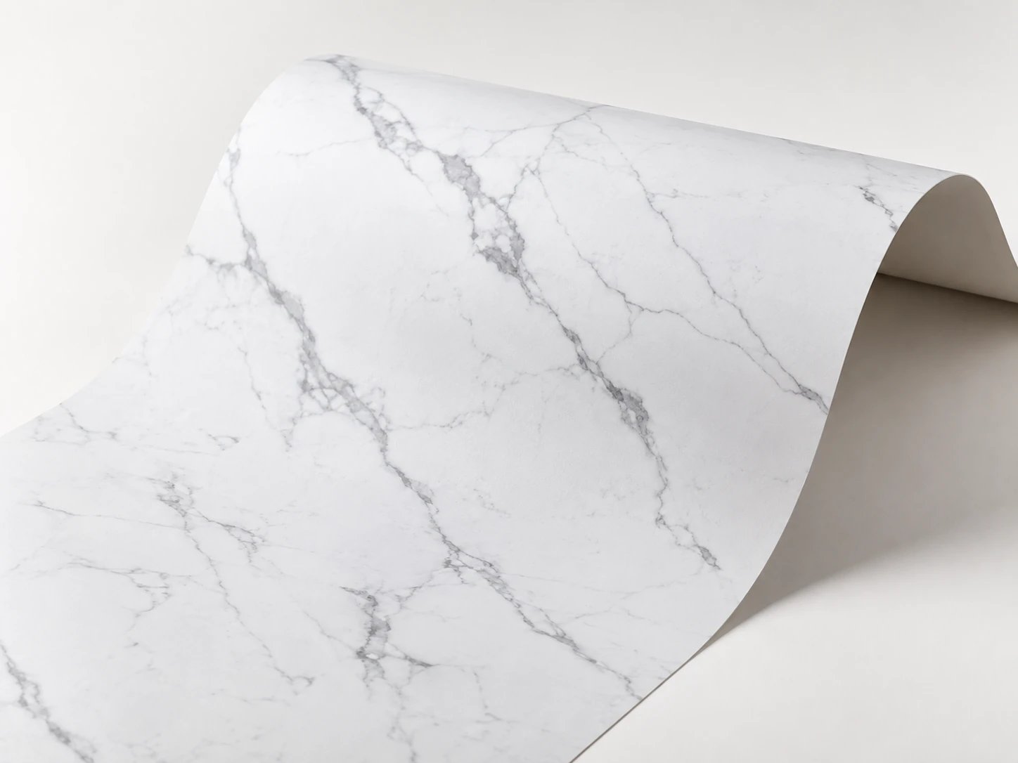Light marble look flexible decorative sheet bending around a curve