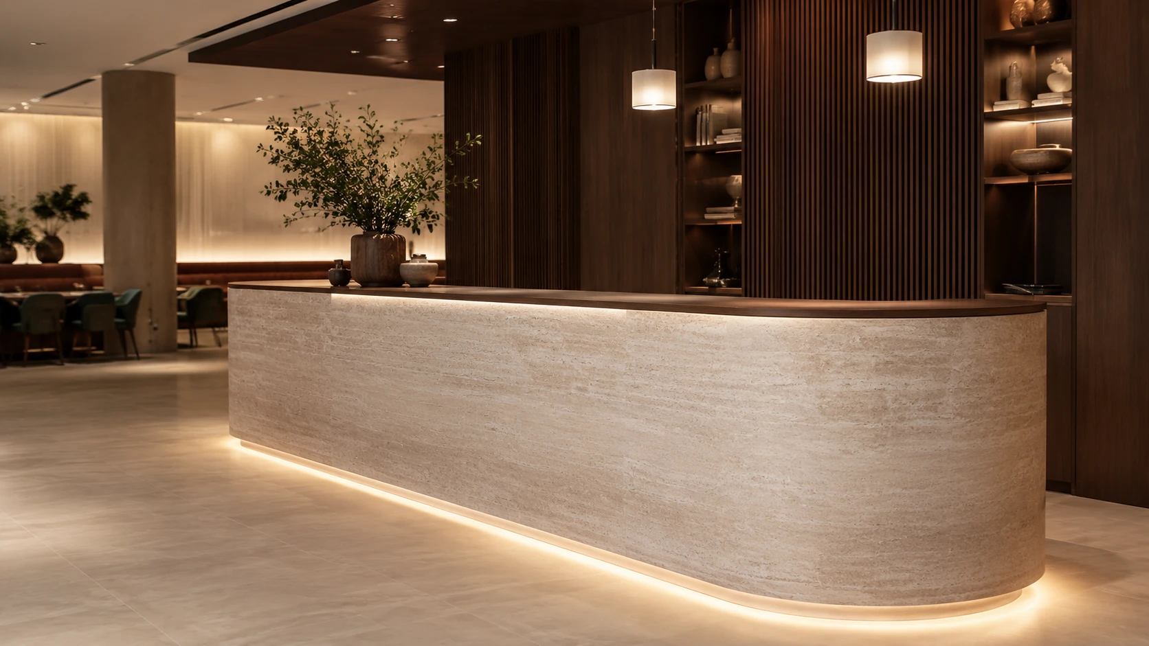 Rounded reception counter finished in a light stone surface